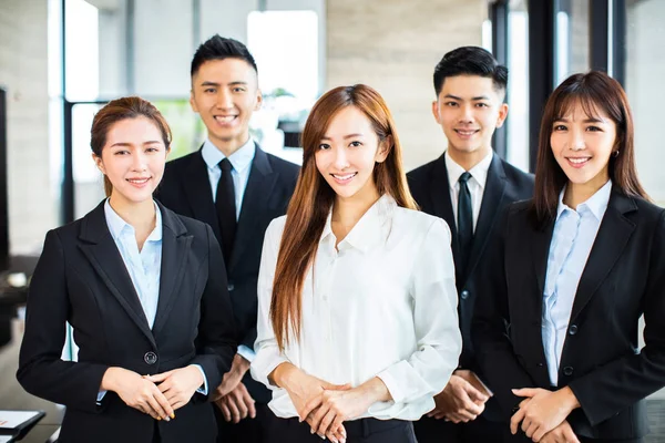 Confident asian business team stands in office — Stock Photo, Image