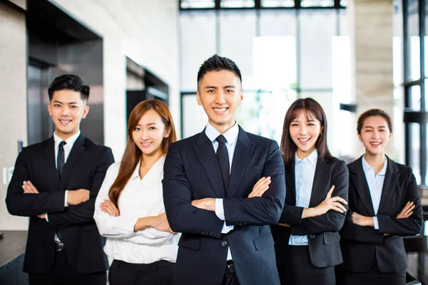 Confident asian business team stands in office — Stock Photo, Image