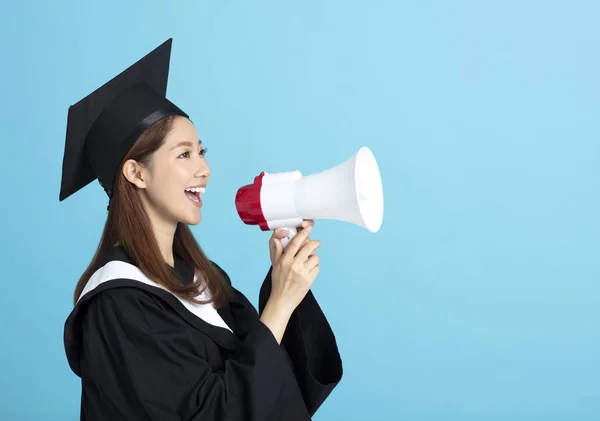 Happy asian female graduate student holding megaphone — Stock Photo, Image