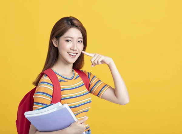 Portret van mooie Aziatische student met uitziend gebaar — Stockfoto