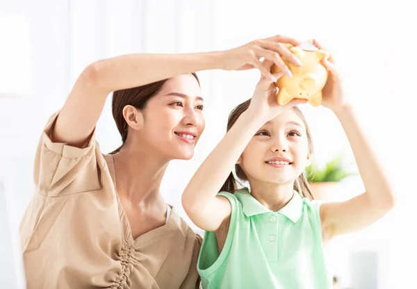 Mother Daughter Checking Piggy Bank Her Future Savings — Stock Photo, Image