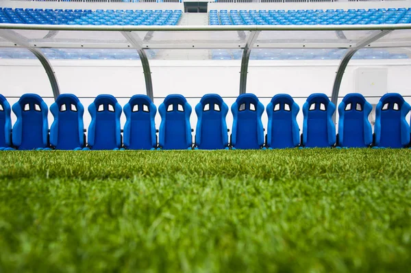 View of blue bench or seat or chair of staff coach in the stadium of football
