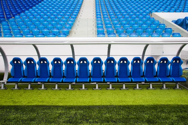 View of blue bench or seat or chair of staff coach in the stadium of football