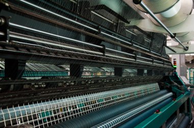 bir tekstil fabrikasında makine iplik Tekstil Sanayi - iplik biriktirir.