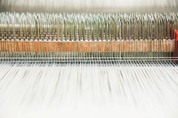 Industrial fabric production line. Weaving looms at a textile factory