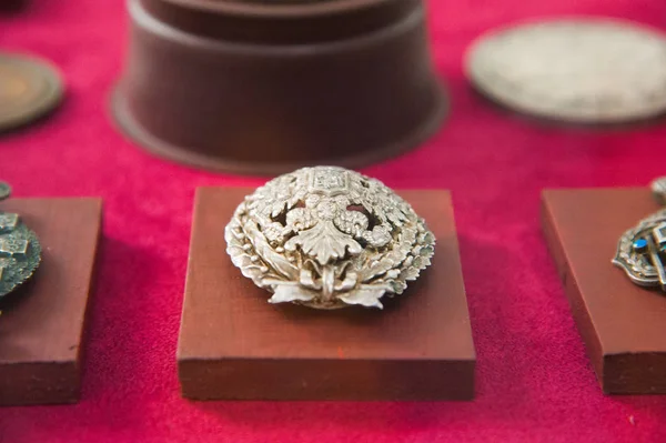 Old retro and modern military orders and military medals on red background