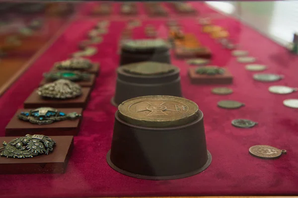 Old retro and modern military orders and military medals on red background