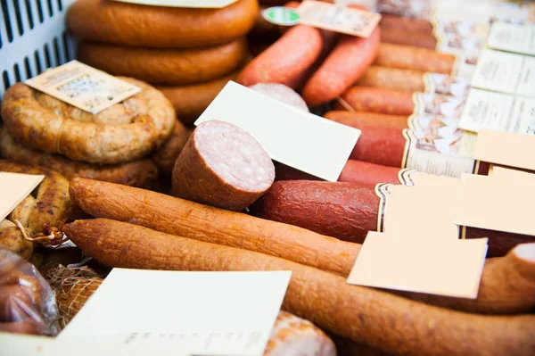Sausages in a butcher shop window — Stock Photo, Image