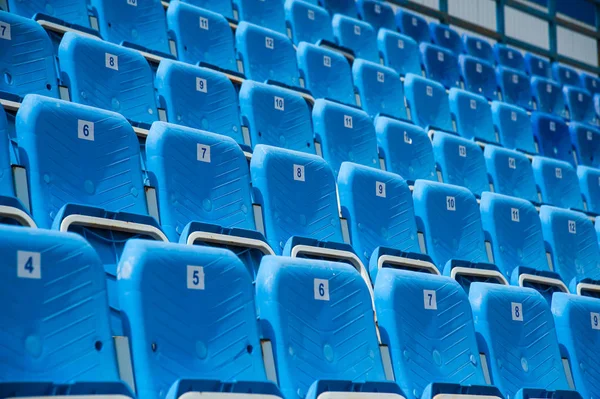 Empty blue seats in stadium Stock Picture