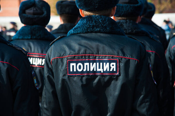 Russian police officers in uniform. Text in russian: "Police"