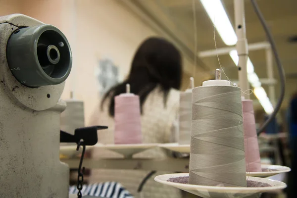 Garment factory. Sewing equipment, fabrics and threads. The process of tailoring