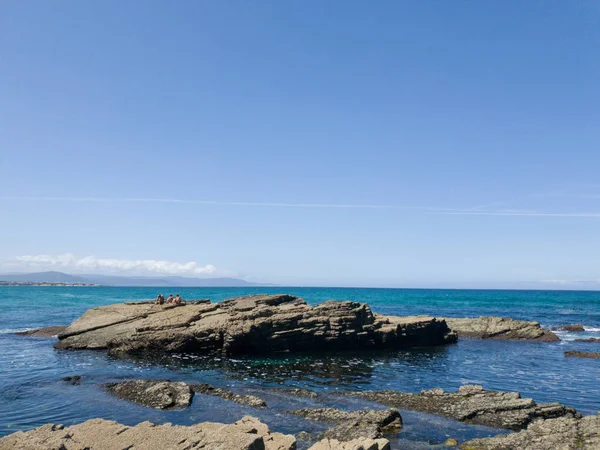 blue sea horizon with rocks landscape