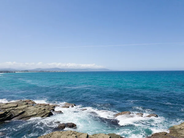 blue sea horizon with rocks landscape