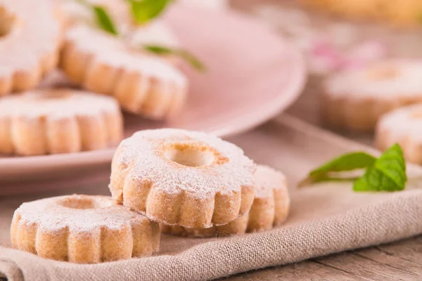 Canestrelli biscuits with icing sugar.