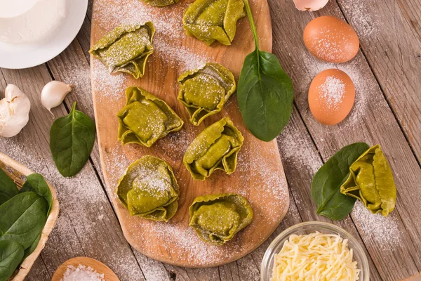 Spinach ravioli with ricotta cheese filling.