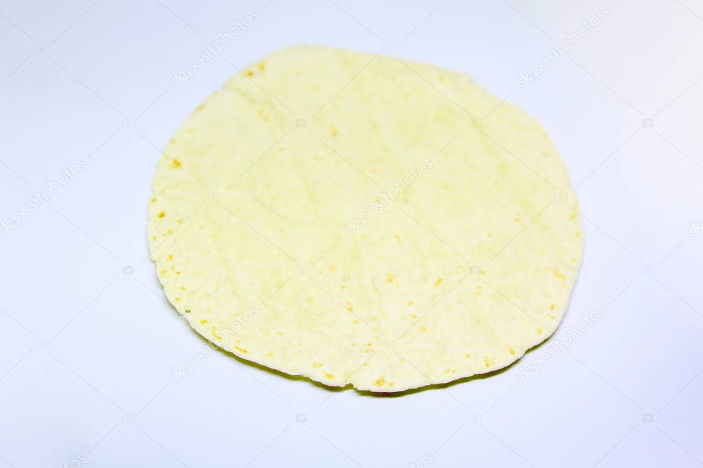 Flour tortilla isolated over a  light grey background
