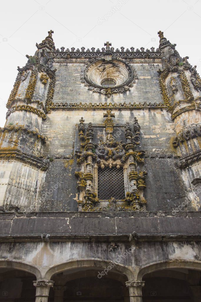 Facade of the Convent of Christ with its famous intricate Manueline window in medieval Templar castle in Tomar, Portugal