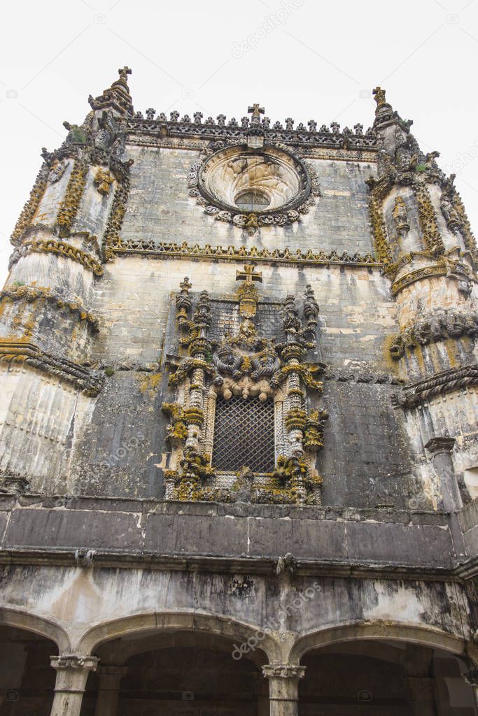 Facade of the Convent of Christ with its famous intricate Manueline window in medieval Templar castle in Tomar, Portugal