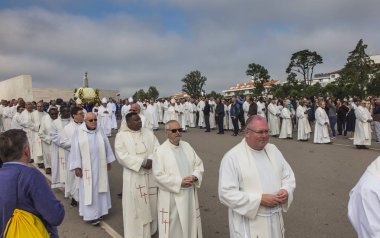 FATIMA, PORTUGAL - June 13, 2018: Church ceremonies related to the apparitions of Our Lady of Fatima, Portugal. Among the bishops Antonio Augusto dos Santos Marto bishop of the Diocese of Leiria-Fatima is currently a cardinal. clipart