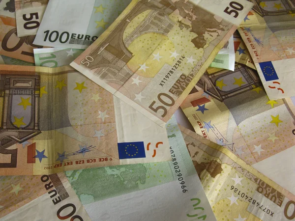 euro banknotes lying scattered on the flat surface