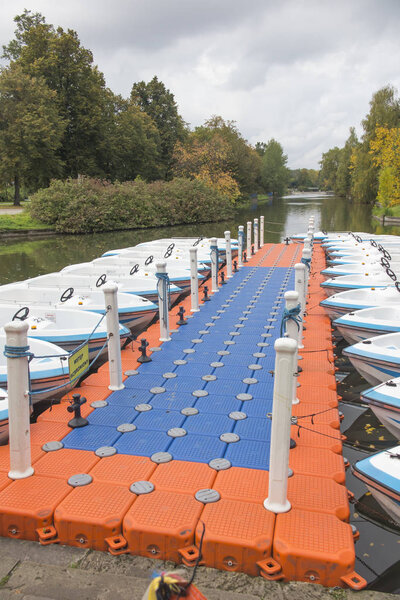 A temporary marina and moored boats on a pond in the Silesian Pa