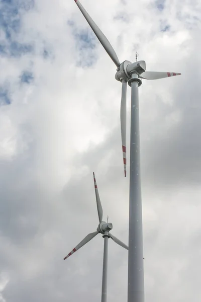 Two large windmills producing ecological electricity from wind