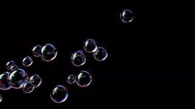 Sabun köpükleri Kara Arkaplanda Uçar ve Patlar. Güzel Kusursuz Döngülü 3D Animasyon Ultra HD 4K 3840x2160