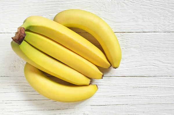 Bunch Yellow Bananas White Wooden Background Top View Copy Space — Stock Photo, Image