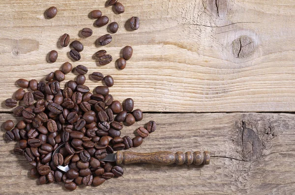 Hoop Koffiebonen Met Lepel Een Oude Houten Achtergrond Ruimte Voor — Stockfoto