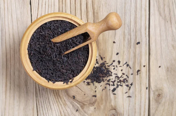 Dry Black Tea Bowl Spoon Wooden Background Top View — Stock Photo, Image