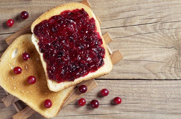 Two Slices Toasted Bread Cranberry Jam Berries Old Wooden Table — Stock Photo, Image