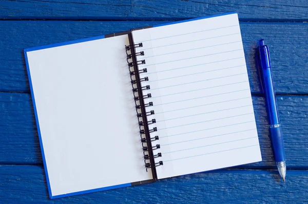 Open notepad with a pen — Stock Photo, Image