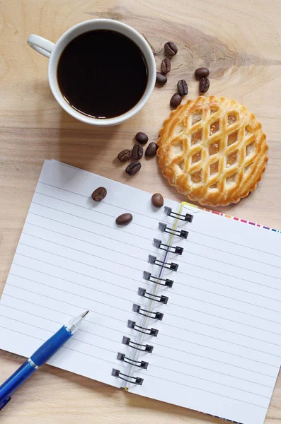 Notebook, coffee and cakes with apple filling — Stock Photo, Image
