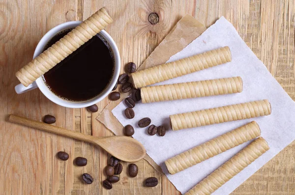 Chocolate wafer stick rolls and coffee — Stock Photo, Image