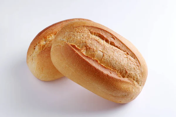 Dva Bochníky Malého Pšeničného Chleba Bílém Pozadí Zblízka — Stock fotografie
