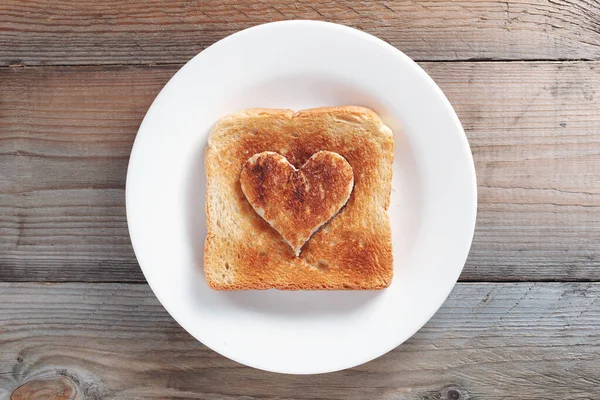 Toast Bread Heart Shape Middle Plate Old Wooden Background Top — Stock Photo, Image