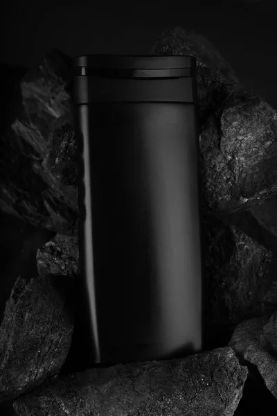 Black Blank Product Bottle on Black Charcoal for Mockups