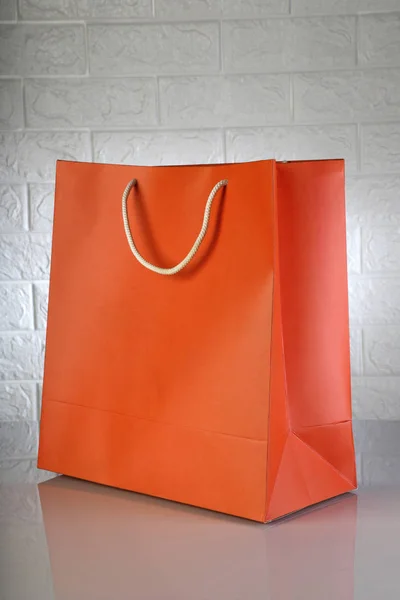 Orange Paper Shopping Bag White Brick Background Mockups — Stock Photo, Image