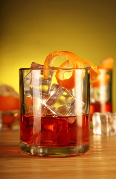 Chilled Alcohol Drink with Ice Cube and Orange Peel