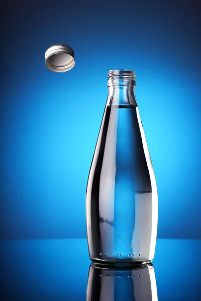The Bottle Cap Challenge Concept - Fresh water in a bottle with