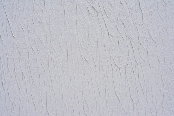 Partie de la texture d'un mur blanc décoré de mastic décoratif Image En Vente