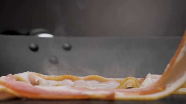 The bacon is fried in a pan. — Stock Video