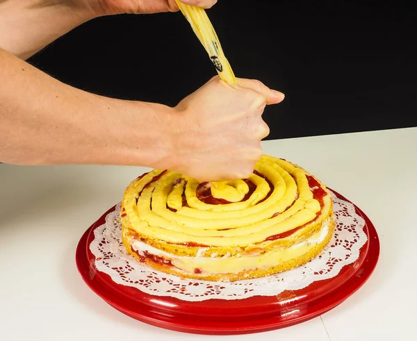 Person Creating Layer Cake Red Plastic Tray — Stock Photo, Image