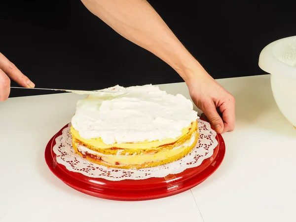 Person Creating Layer Cake Red Plastic Tray — Stock Photo, Image