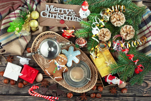 Merry Christmas card with gifts and, coffee and Christmas decorations.