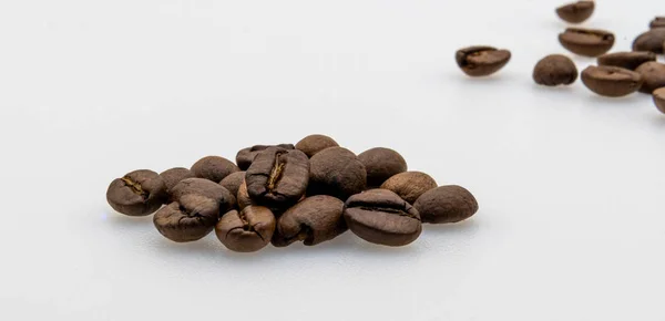 Coffee beans and few alone — Stock Photo, Image