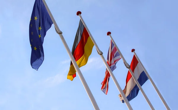 Flags England United Kingdom Germany Nederlands Waving Flagpoles Together European — Stock Photo, Image