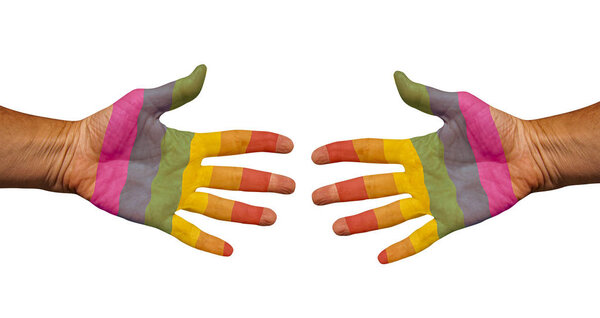 Two hands painted in LGBTQ rainbow flag colors reach out to each other for a handshake. Isolated on white background. Lesbian, Gay, Transgender, Bisexual and Queer. - Image