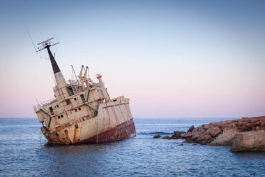 Abandoned rusty ship Edro III near Pegeia, Paphos, Cyprus at sun clipart