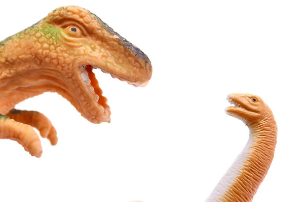 아이들은 배경에 떨어져 공룡을 장난감으로 돌본다 — 스톡 사진